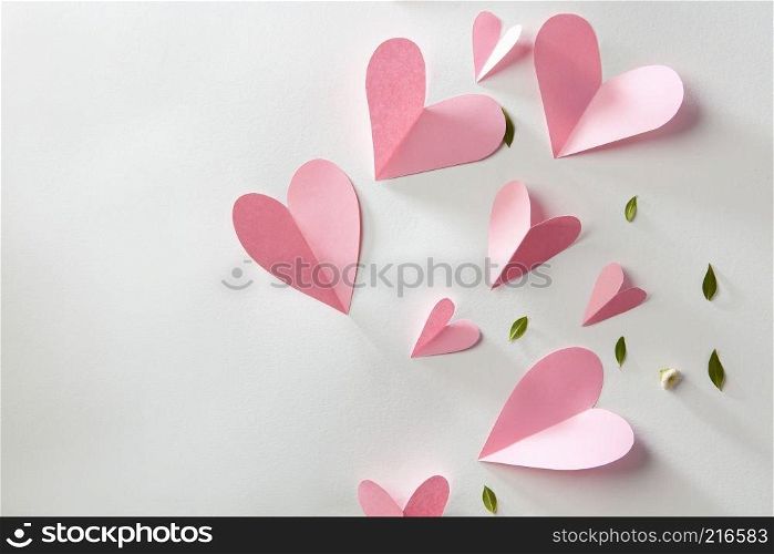 Origami paper hearts on a white background with space for text. Valentines gift card