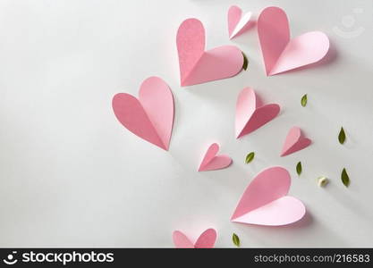 Origami paper hearts on a white background with space for text. Valentines gift card