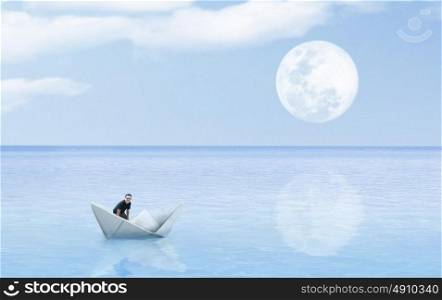 origami paper sailboat sailing on blue water concept art