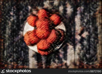 Original Black Forest Bollen hat in front of wooden wall in surrealistic style