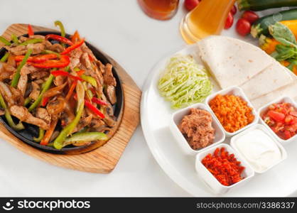 original fajita sizzling smoking hot served on iron plate and fresh vegetables on background ,MORE DELICIOUS FOOD ON PORTFOLIO