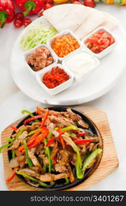 original fajita sizzling smoking hot served on iron plate and fresh vegetables on background ,MORE DELICIOUS FOOD ON PORTFOLIO