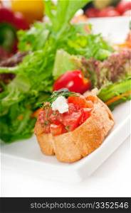 original Italian fresh bruschetta,typical finger food, with fresh salad and vegetables on background,MORE DELICIOUS FOOD ON PORTFOLIO