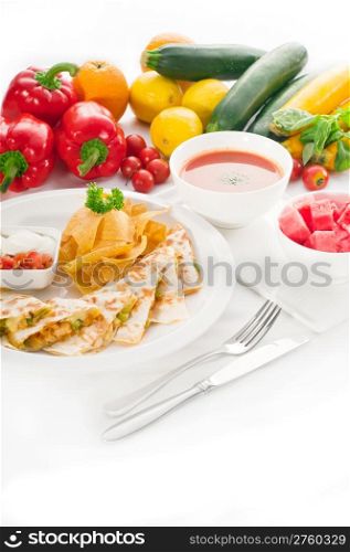 original Mexican quesadilla de pollo with nachos served with gazpacho soup and watermelon ,with fresh vegetables on background,MORE DELICIOUS FOOD ON PORTFOLIO