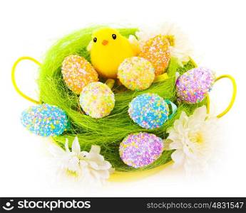 Original painted Easter eggs decorated with flowers and little yellow chick toy in basket isolated on white background