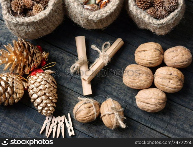 Ornamental object for Xmas holiday, group of christmas pine cone, beauty red heart, group of handmade basket, message, wooden background
