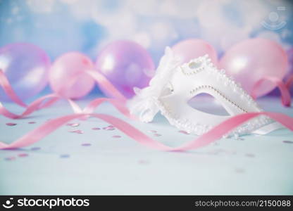 ornamental white mask pink streamers
