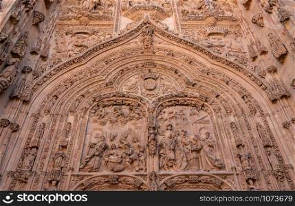 Ornate bible carvings in the facade and entrance to the old Cathedral in Salamanca. Ornate carvings at the entrance to the old Cathedral in Salamanca