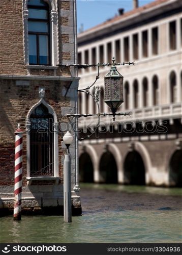 Ornate light over canal in Venice