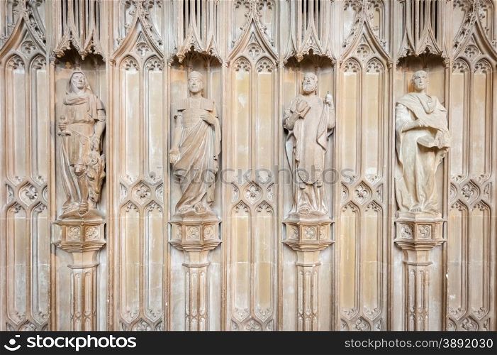 ornate medieval stone statues in Winchester Cathedral, UK