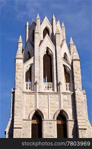 Ornate stone tower of St Augustine Catholic Church and School in Washington DC