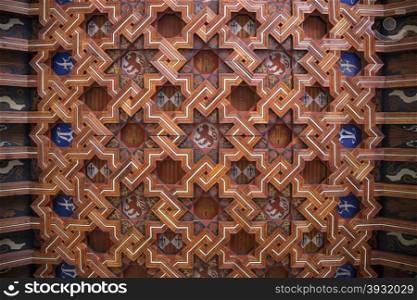 Ornate wooden ceiling design in the cloisters of Toledo Cathedral in the city of Toledo in the La Mancha region of central Spain.