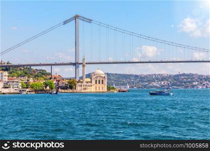 Ortakoy Mosque under the Bosphorus Bridge, Istanbul, Turkey.. Ortakoy Mosque under the Bosphorus Bridge, Istanbul, Turkey