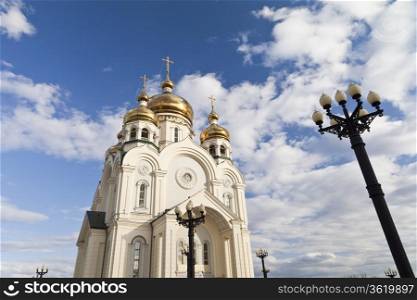Orthodox church against the blue sky and white clouds