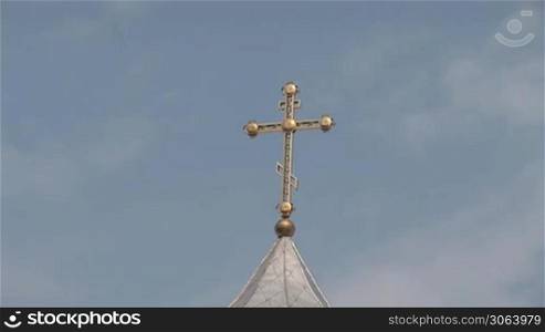 Orthodox cross on the dome of the monastery