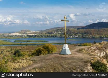 Orthodox cross on top of a hill