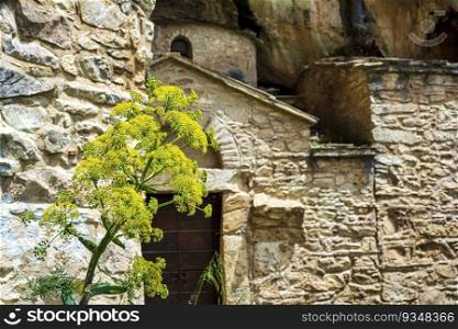 Orthodox monastery enclosed by Davelis cave in Penteli, a mountain to the north of Athens, Greece.. Orthodox monastery enclosed by Davelis cave in Penteli, a mountain to the north of Athens, Greece