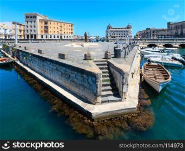 Ortigia island entrance at city of Syracuse, Sicily, Italy. Beautiful travel photo of Sicily. People unrecognizable.