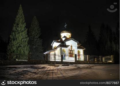 Ortodox church in mountain in the night
