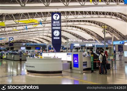 OSAKA, JAPAN - MARCH 14, 2018: Information centre service inside the Kansai International Airport (KIX) is one of Japan most important commercial airports.