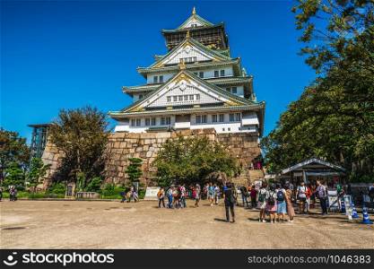 Osaka, Japan - September 28, 2018: Tourist and people visit the Osaka castle in Osaka, Japan. It is the famous landmark and popular tourist destination of Osaka.