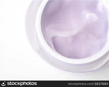 osmetic cream close up in container isolated on white background