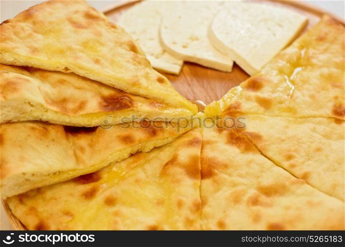 ossetian pie on a white. ossetian pie with cheese on a white background