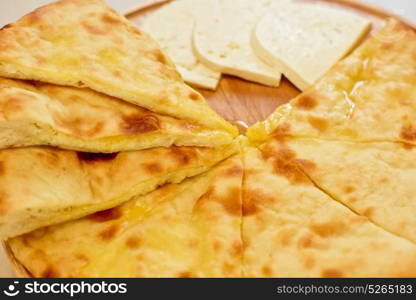 ossetian pie on a white. ossetian pie with cheese on a white background