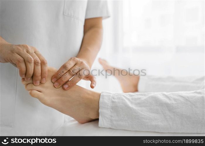 osteopathist treating patient his feet. Resolution and high quality beautiful photo. osteopathist treating patient his feet. High quality beautiful photo concept