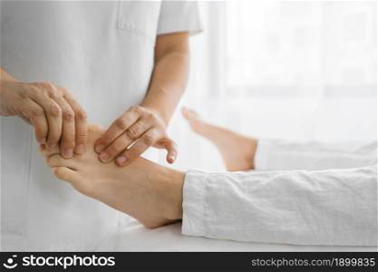 osteopathist treating patient his feet. Resolution and high quality beautiful photo. osteopathist treating patient his feet. High quality beautiful photo concept