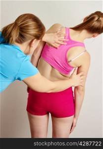 Osteopathy treatment, the professional masseuse and her patient