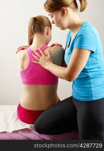 Osteopathy treatment, the professional masseuse and her patient