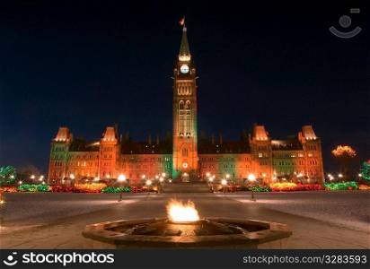 Ottawa&acute;s eteranl flame in front of Parliament Buildings at Christmas.