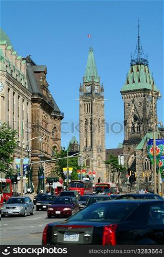 Ottawa&acute;s Parliament Buildings with traffic.