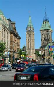 Ottawa&acute;s Parliament Buildings with traffic.