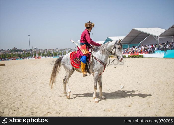 Ottoman horseman in his ethnic clothes riding on his horse