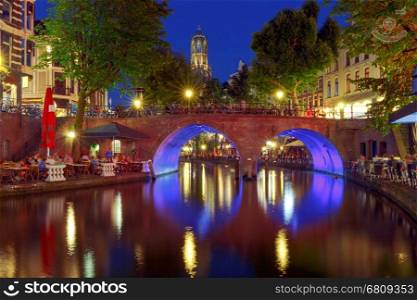 Oudegracht canal in night illumination at sunset. Utrecht. Netherlands.