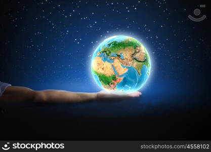 Our Earth planet. Close up of human hand holding Earth planet. Elements of this image are furnished by NASA