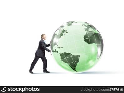 Our Earth planet. Determined businessman pushing big digital Earth planet