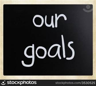 ""Our goals" handwritten with white chalk on a blackboard."