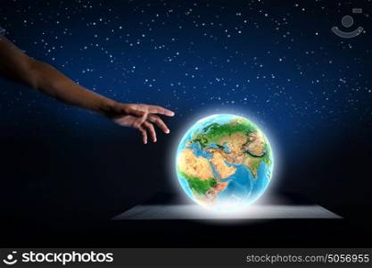 Our home. Close up of human hand holding Earth planet. Elements of this image are furnished by NASA