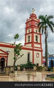 Our Lady of Candelaria Cathedral with palm in the foreground, center of Camaguey city, Cuba