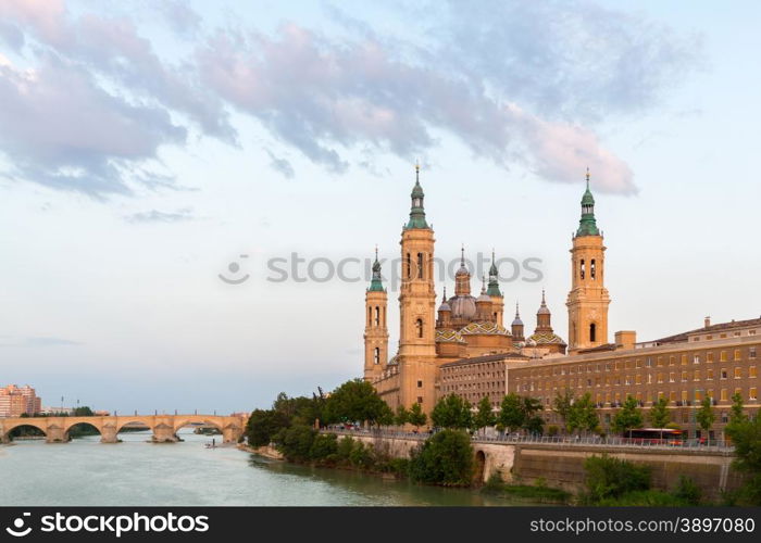 Our Lady of the Pillar Basilica with Ebro River at dusk Zaragoza, Spain