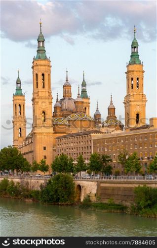 Our Lady of the Pillar Basilica with Ebro River at dusk Zaragoza, Spain