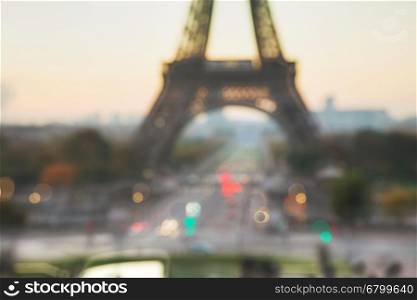 Out of focus cityscape with the Eiffel tower in Paris, France at sunrise