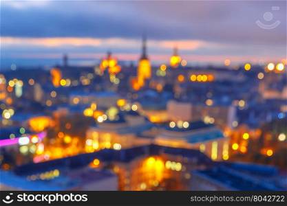 Out-of-focus shimmering city background, blurred bokeh photo of old town at sunset, Tallinn, Estonia