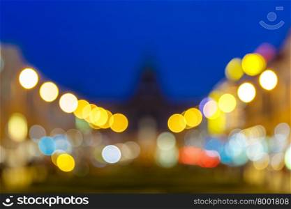 Out-of-focus shimmering city background, blurred bokeh photo of Wenceslas Square at night, Prague, Czech Republic.