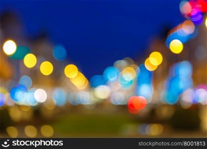 Out-of-focus shimmering city background, blurred bokeh photo of Wenceslas Square at night, Prague, Czech Republic.
