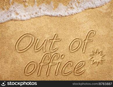 Out of office sign on beach sand