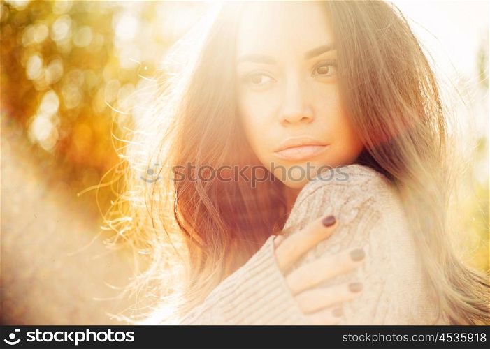 Outdoor atmospheric fashion photo of young beautiful lady in autumn landscape